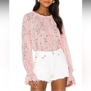Free People Olivia Balloon Sleeve Lace Blouse in pink.